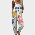 Woman wearing cream overalls printed with colourful hens, little blue chicks and proud cockerels