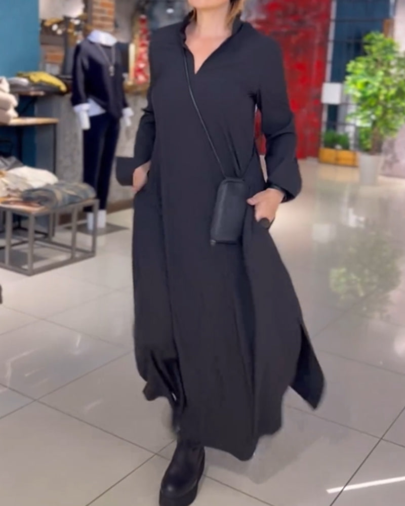 Woman wearing the Patricia relaxed maxi dress with revere collar, standing by a doorway.