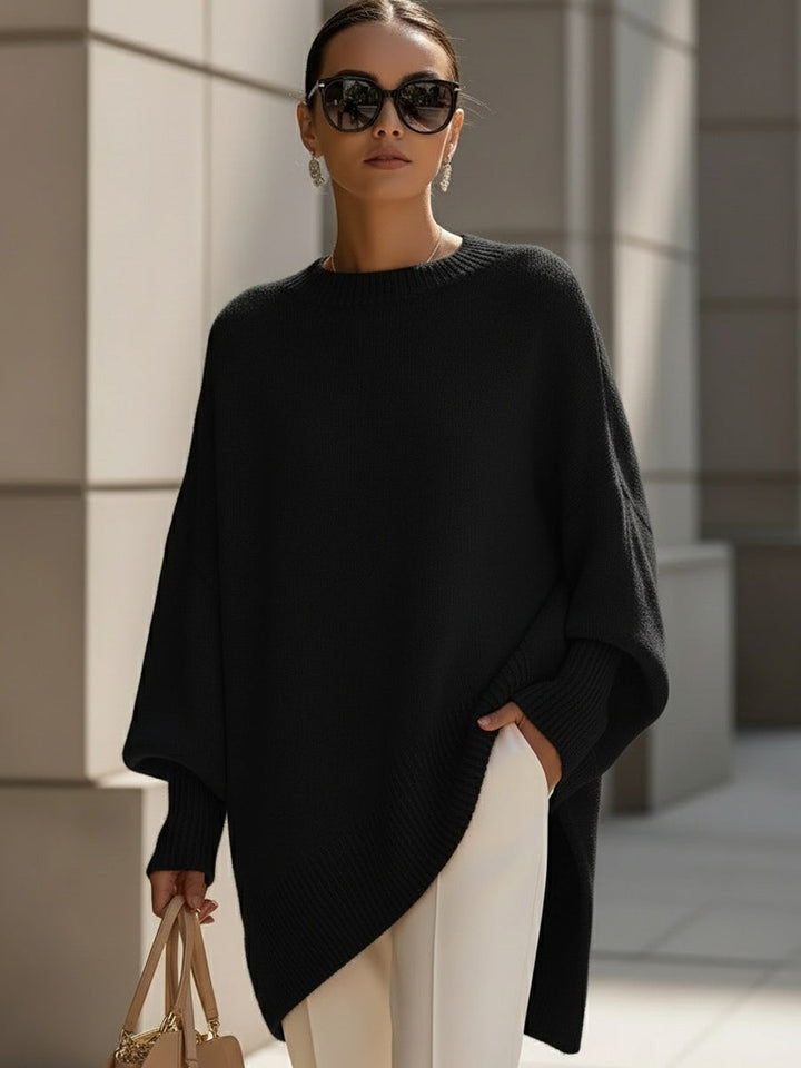 A woman wearing a soft crew neck sweater with jeans for a warm, easy everyday look.