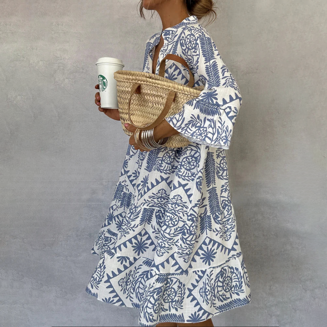 Woman wearing the Elaine button-front boho tunic dress, relaxed on a casual day out.