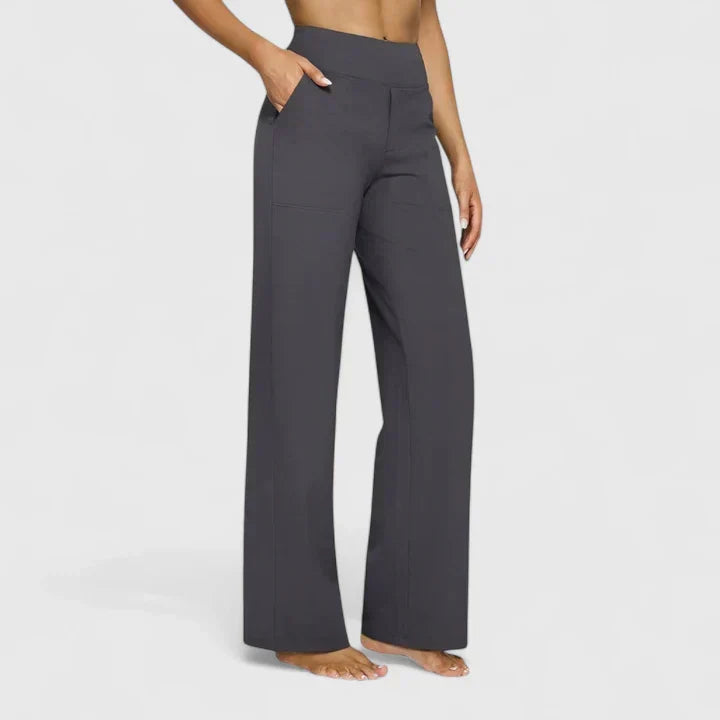 A woman in tailored pants styled with a simple top for an elegant, comfortable everyday look.