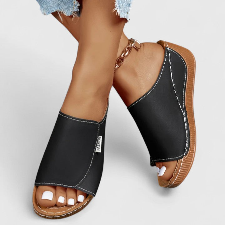 A woman in tan lightweight sandals stepping out gracefully, feet cushioned and supported.