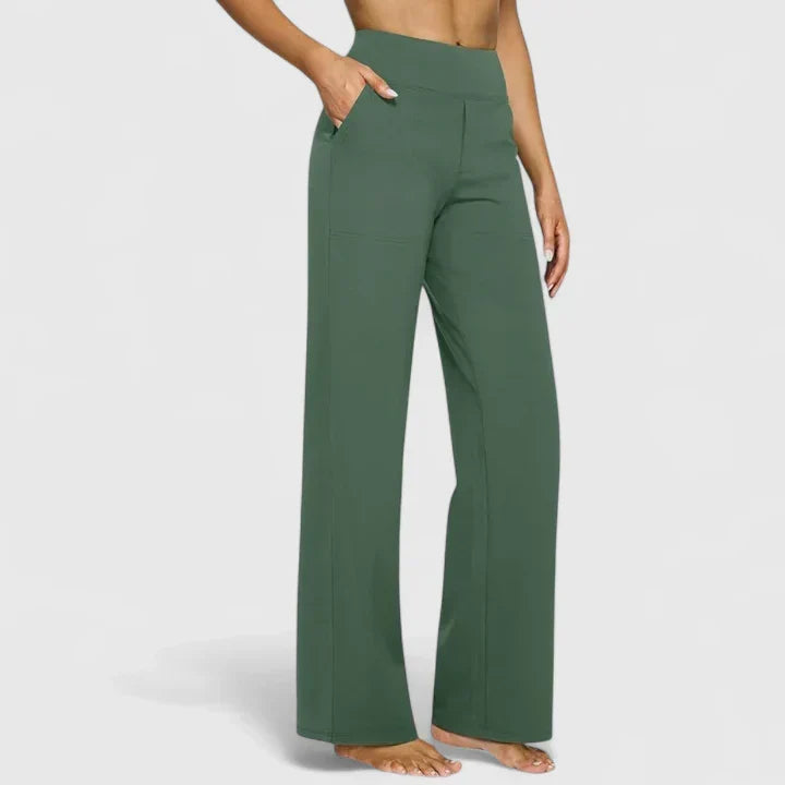 A woman in tailored pants styled with a simple top for an elegant, comfortable everyday look.