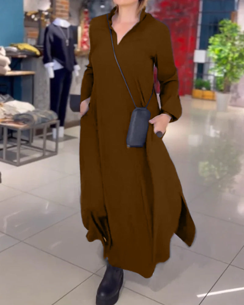 Woman wearing the Patricia relaxed maxi dress with revere collar, standing by a doorway.