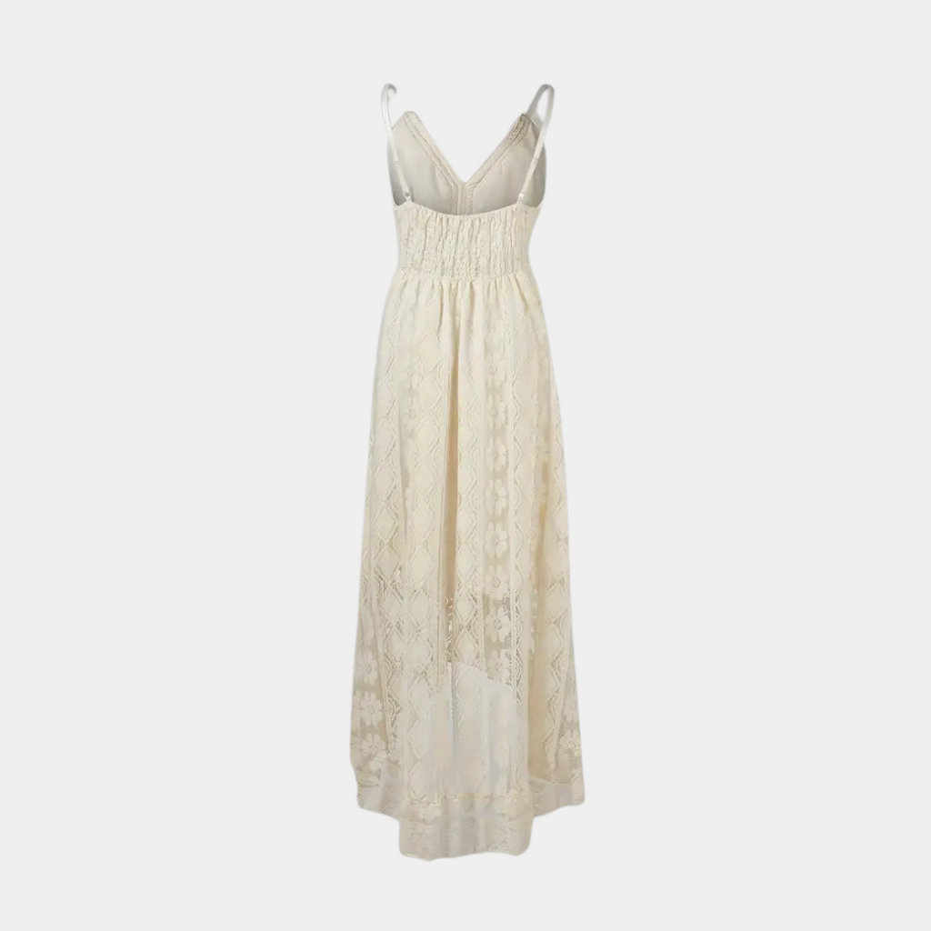 Woman wearing the Jill™ elegant boho midi dress with intricate detailing and a V-neckline at a summer garden party.