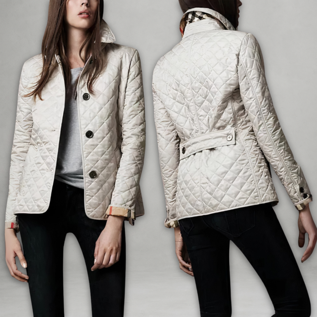 A woman wearing an fall jacket over a top, layered for a crisp day in town.