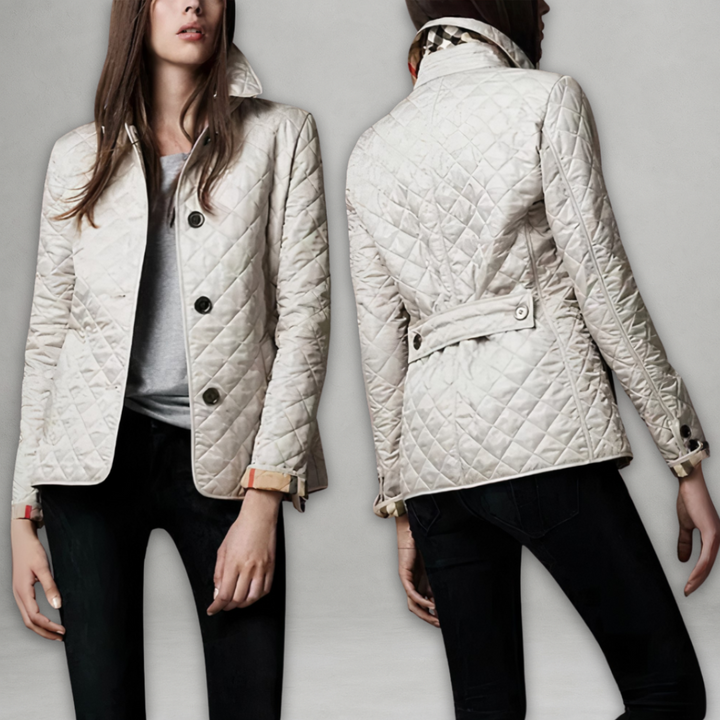 A woman wearing an fall jacket over a top, layered for a crisp day in town.