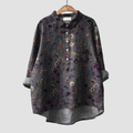 Woman wearing a breezy printed summer blouse with a soft, flattering flow.