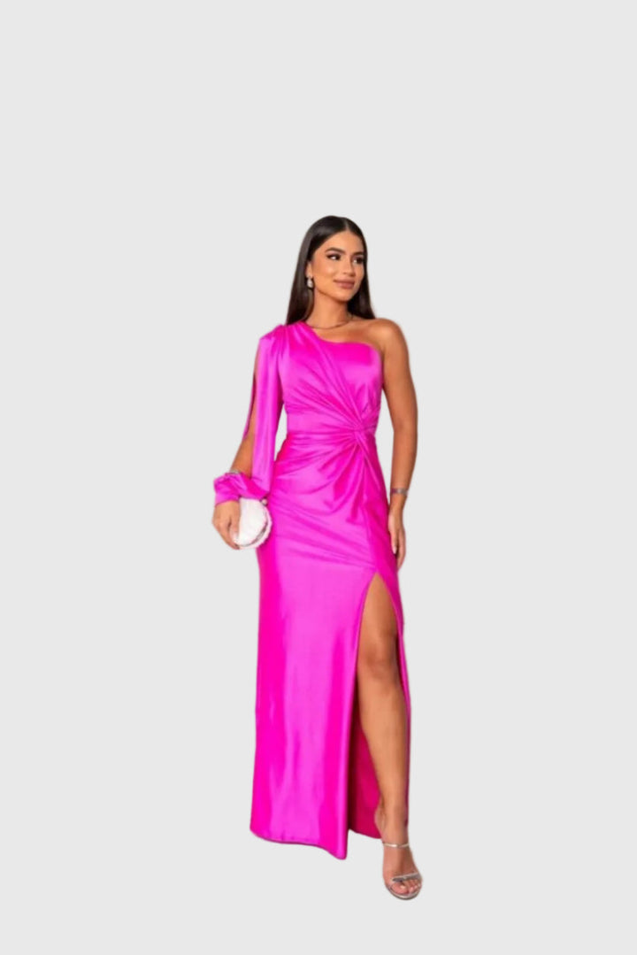 Woman wearing a long flowing evening maxi dress with elegant, graceful lines.