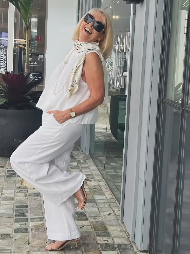 A woman wearing a chic minimal two-piece set with a soft, flattering silhouette.