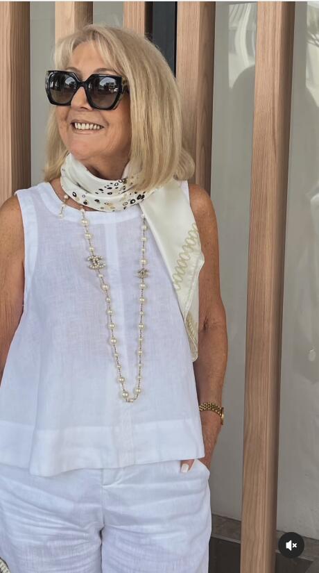 A woman wearing a chic minimal two-piece set with a soft, flattering silhouette.