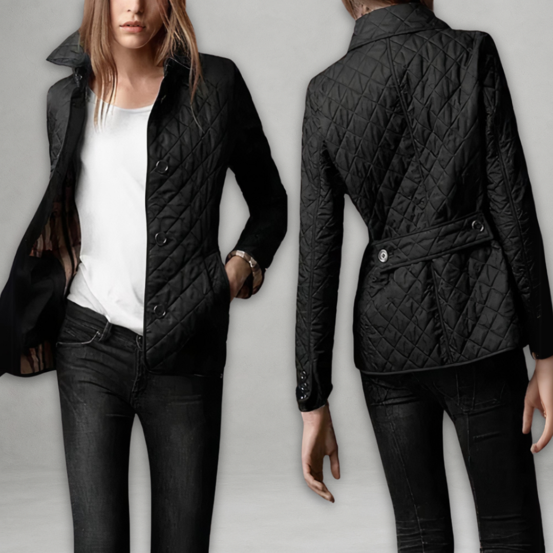 A woman wearing an fall jacket over a top, layered for a crisp day in town.