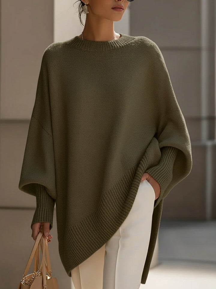 A woman wearing a soft crew neck sweater with jeans for a warm, easy everyday look.