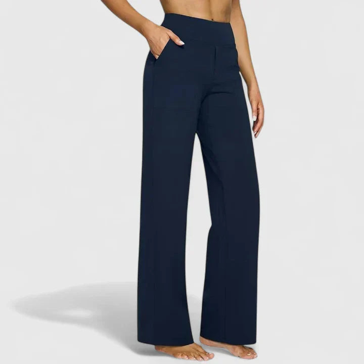 A woman in tailored pants styled with a simple top for an elegant, comfortable everyday look.