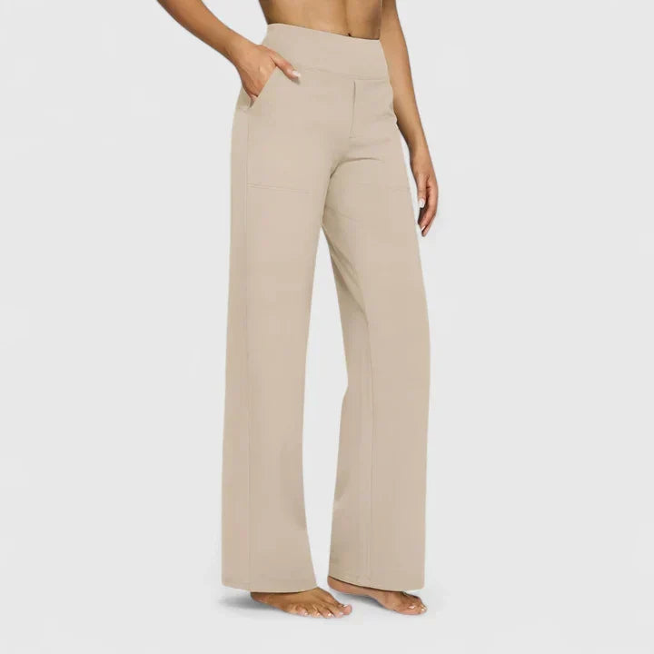 A woman in tailored pants styled with a simple top for an elegant, comfortable everyday look.