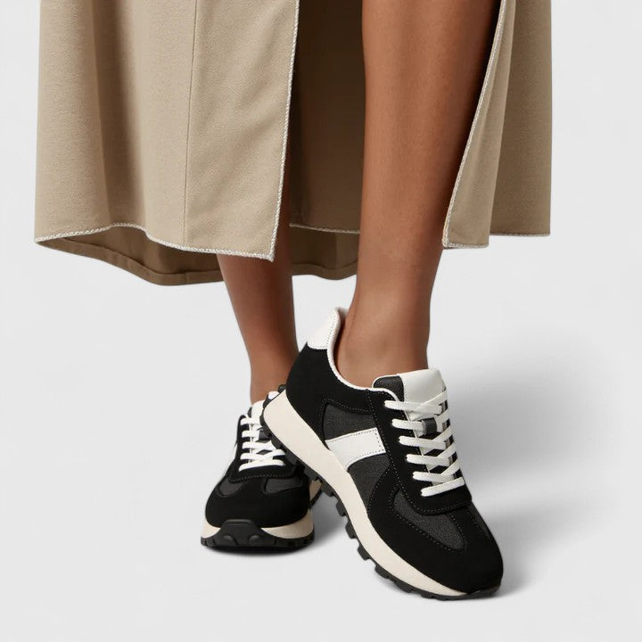 A woman wearing elegant shoes with a discreet height lift