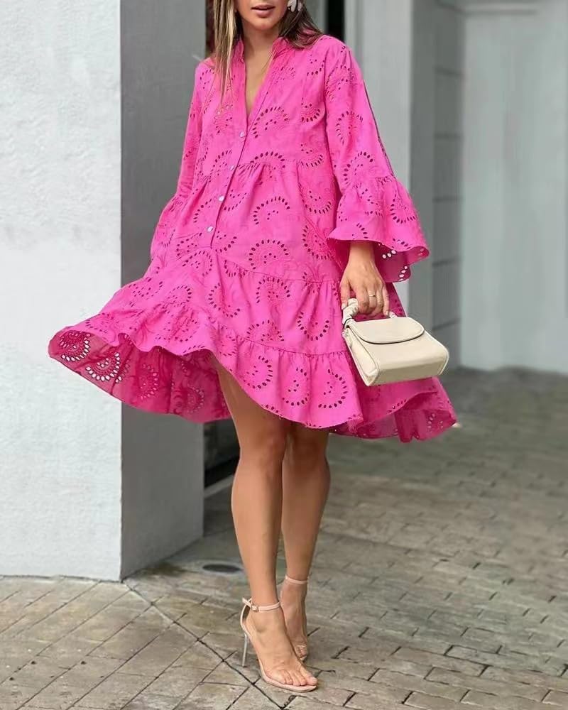 Woman in a breezy mini dress with delicate eyelet detailing and softly tiered skirt.