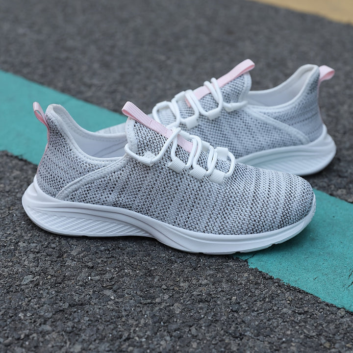 A woman walking comfortably in lightweight breathable sneakers with pants
