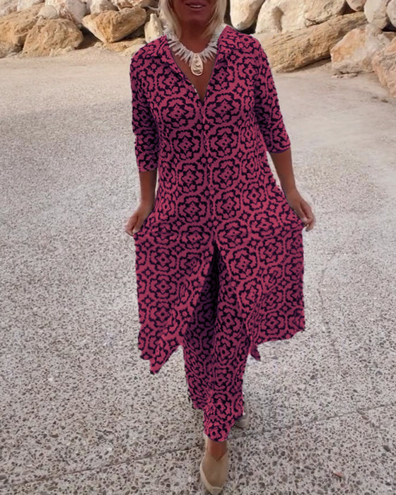 A woman wearing a black-and-white geometric-print longline top with matching pants, standing outdoors.