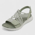 A woman walking freely in lightweight wide-fit orthopaedic sandals with an open front.