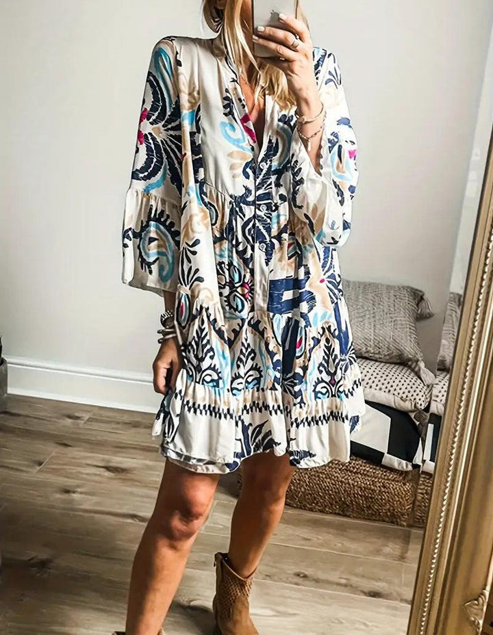 A woman wearing a relaxed boho print tunic dress on a warm, sunny day.