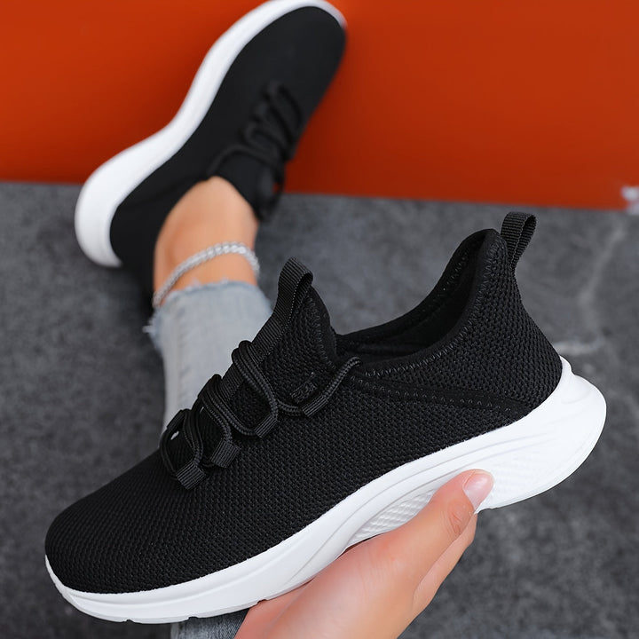 A woman walking comfortably in lightweight breathable sneakers with pants