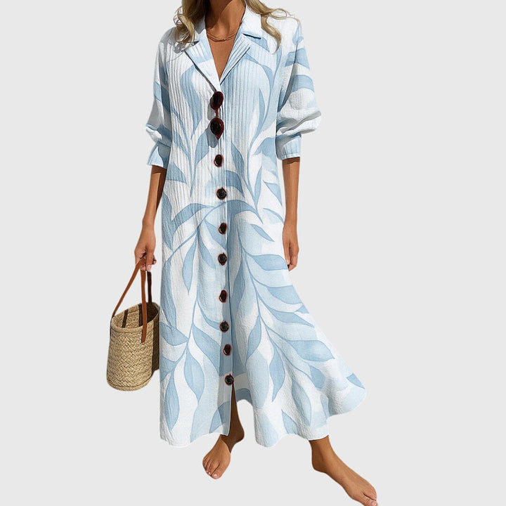 Woman wearing a romantic bohemian maxi dress with delicate patterns and a softly draped silhouette.