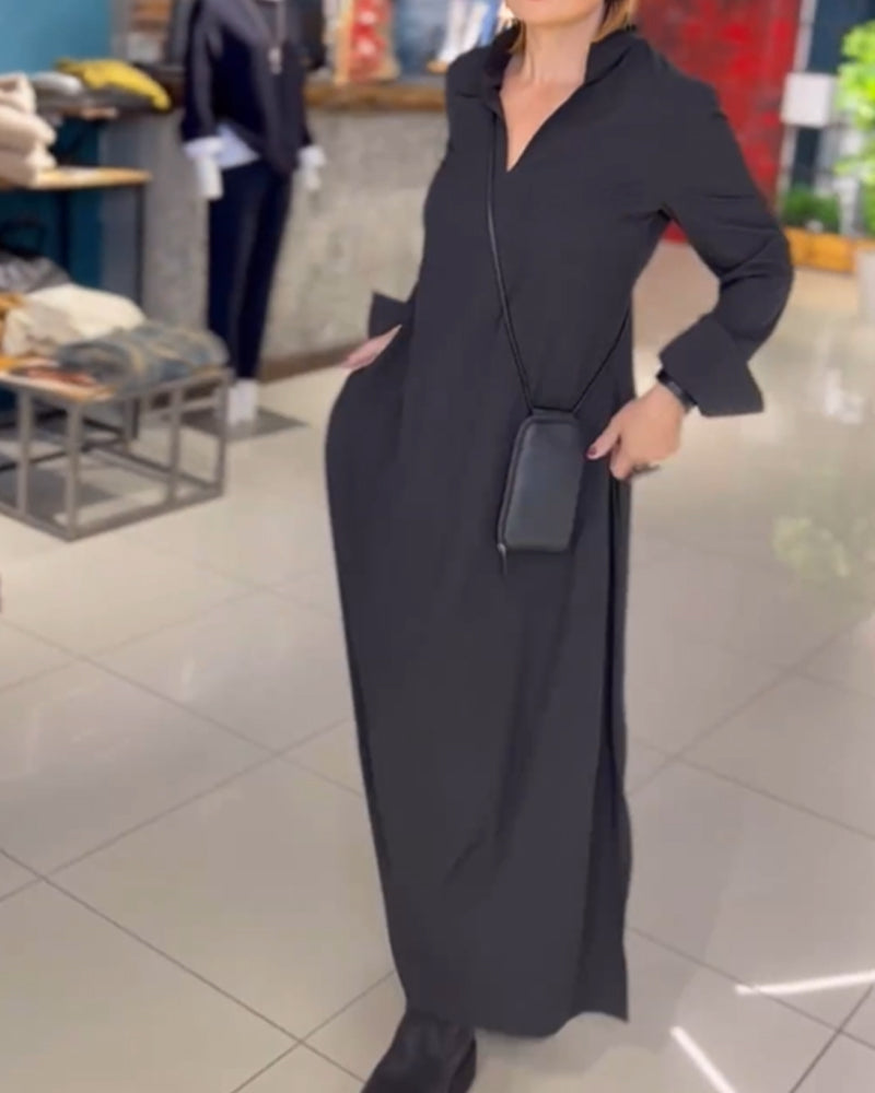 Woman wearing the Patricia relaxed maxi dress with revere collar, standing by a doorway.