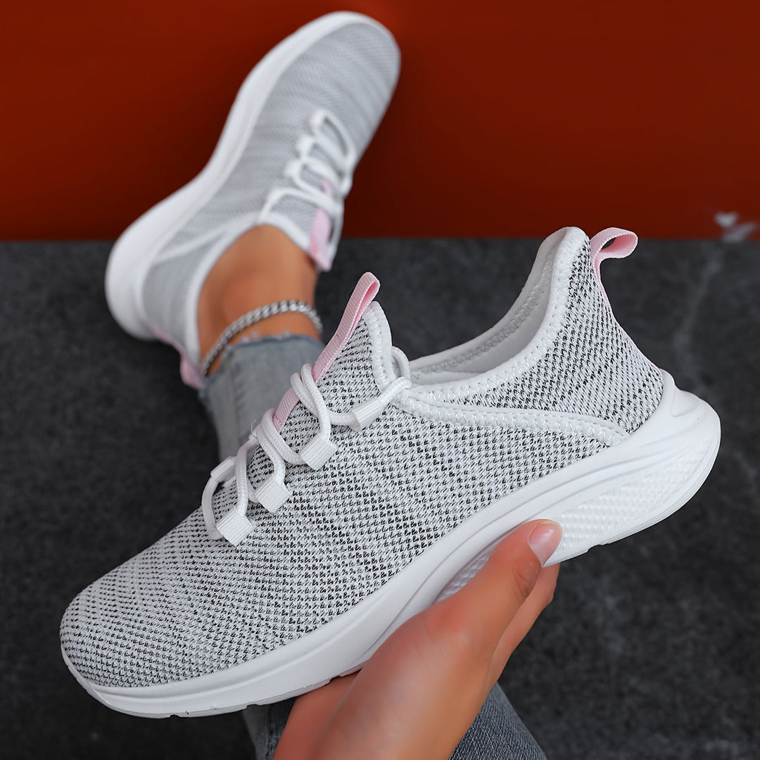 A woman walking comfortably in lightweight breathable sneakers with pants