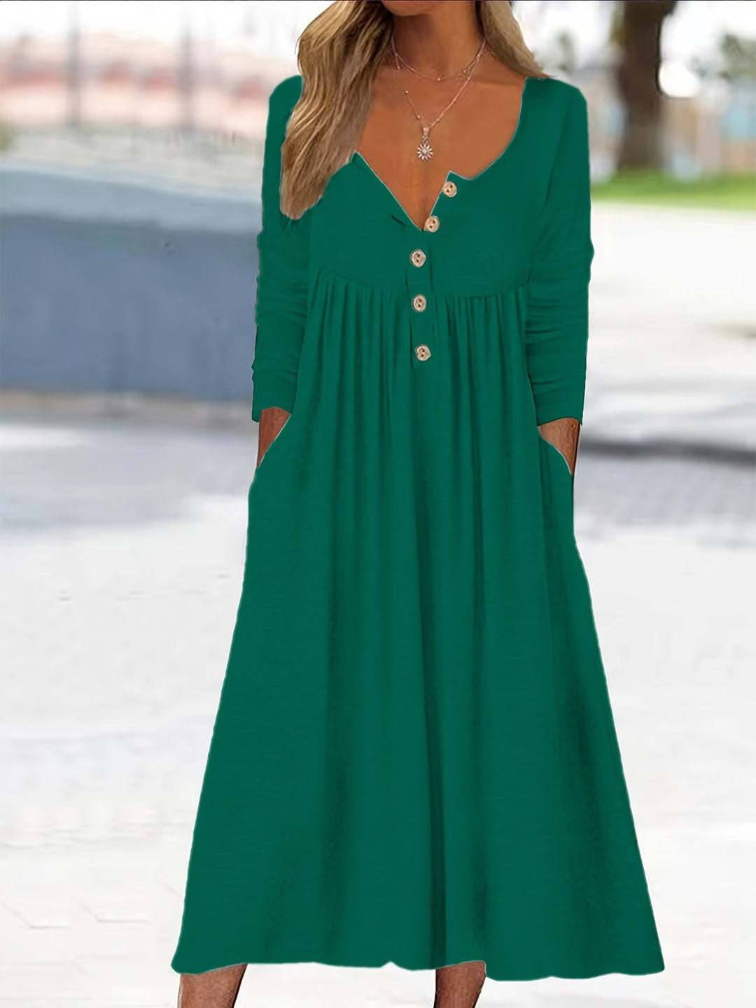 A woman wearing the Tina button-front midi dress with an A-line skirt, dressed for a casual day out.