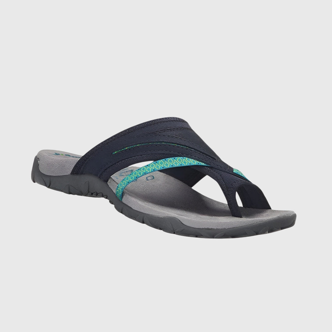 A woman wearing open-toe supportive sandals with a light summer outfit, walking comfortably and looking confident.