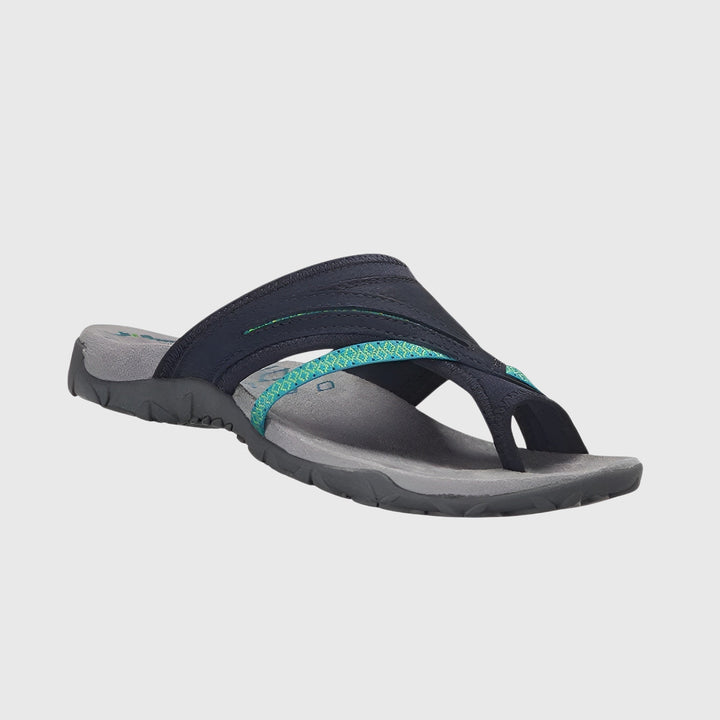 A woman wearing open-toe supportive sandals with a light summer outfit, walking comfortably and looking confident.