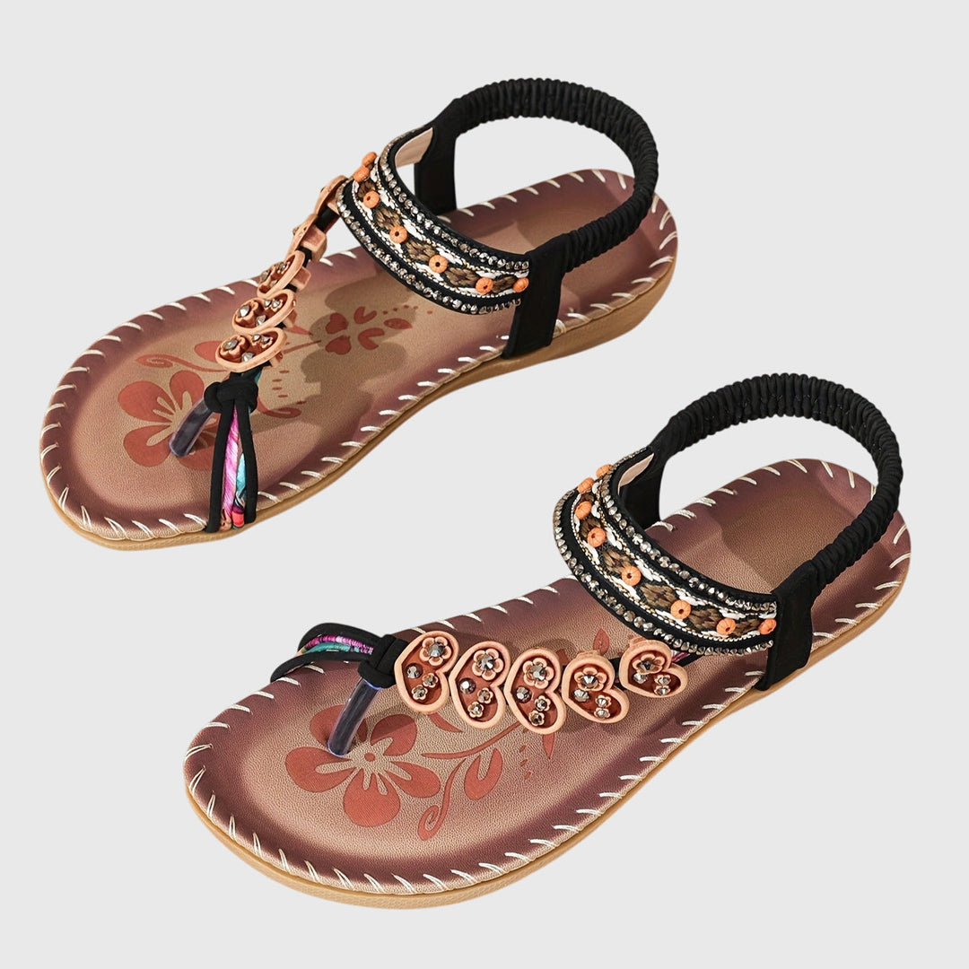 A woman standing comfortably in wide-fit cushioned support sandals with open-toe straps.