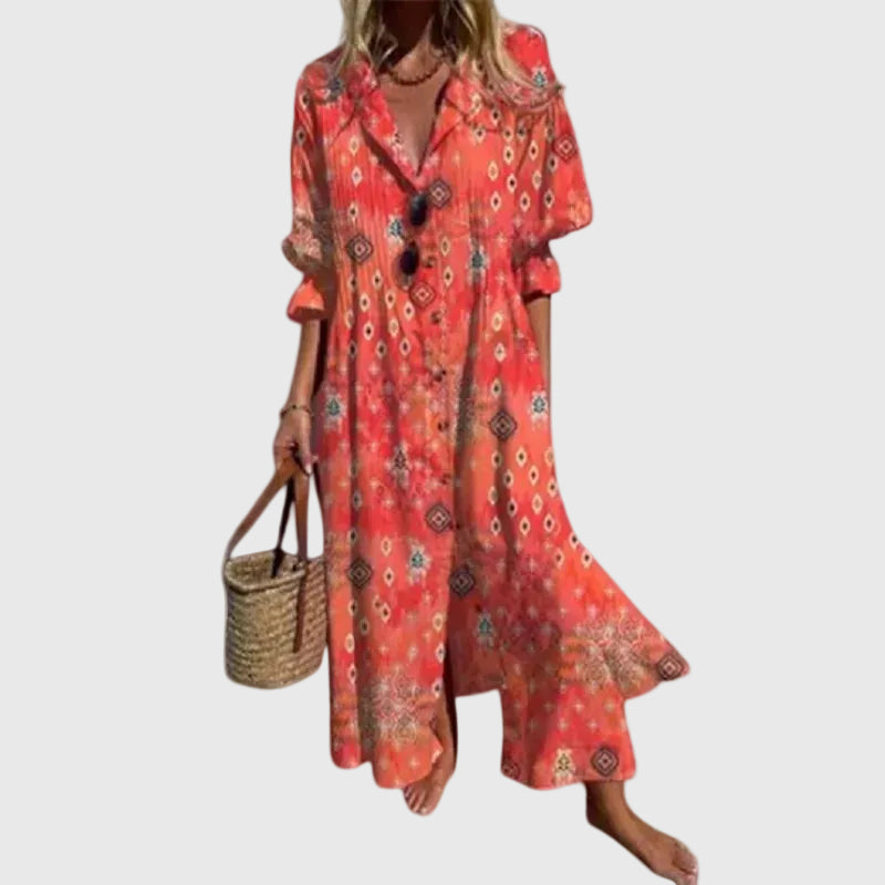 Woman in a long flowing boho-style maxi dress with delicate patterns, walking outdoors.