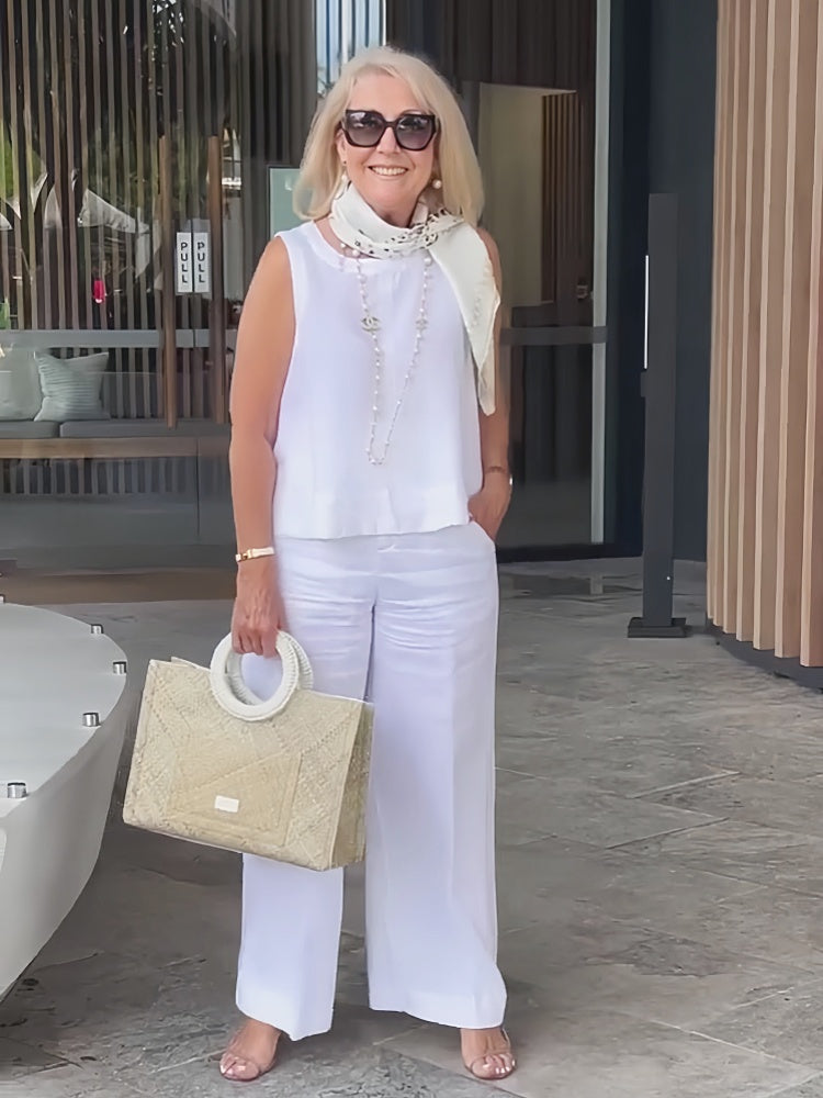 A woman wearing a chic minimal two-piece set with a soft, flattering silhouette.