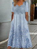 Woman wearing the Catherine soft floral midi dress at a garden gathering.
