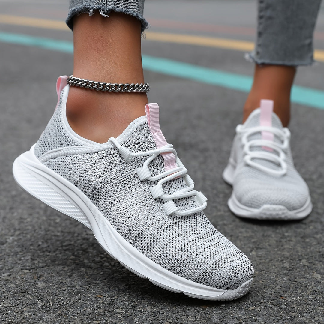 A woman walking comfortably in lightweight breathable sneakers with pants