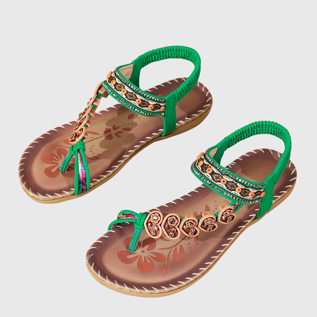 A woman standing comfortably in wide-fit cushioned support sandals with open-toe straps.