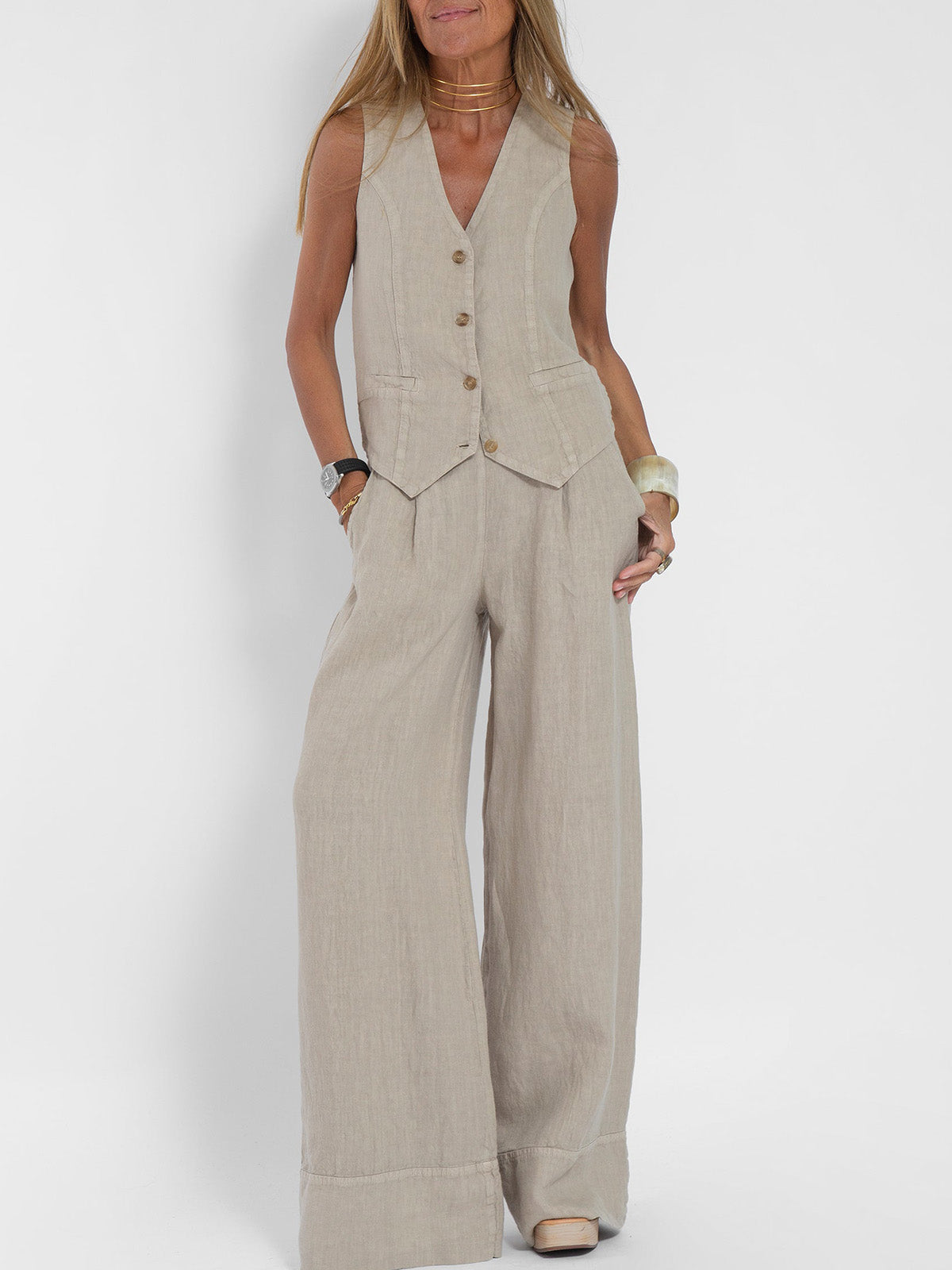 A woman wearing a tailored waistcoat with flowing wide-leg pants