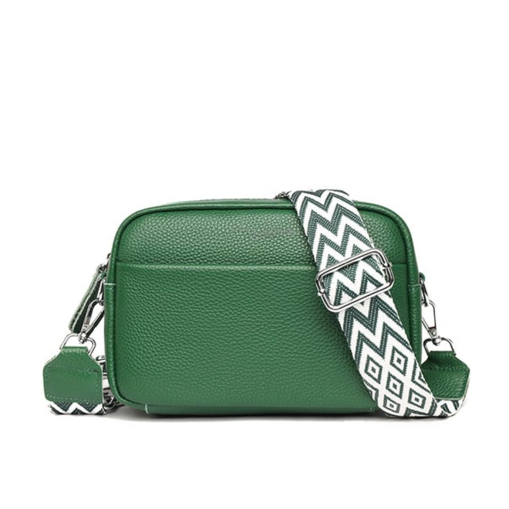 A woman wearing a timeless cross-body bag across her body while out and about