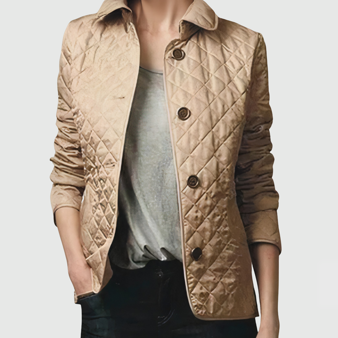 A woman wearing an fall jacket over a top, layered for a crisp day in town.