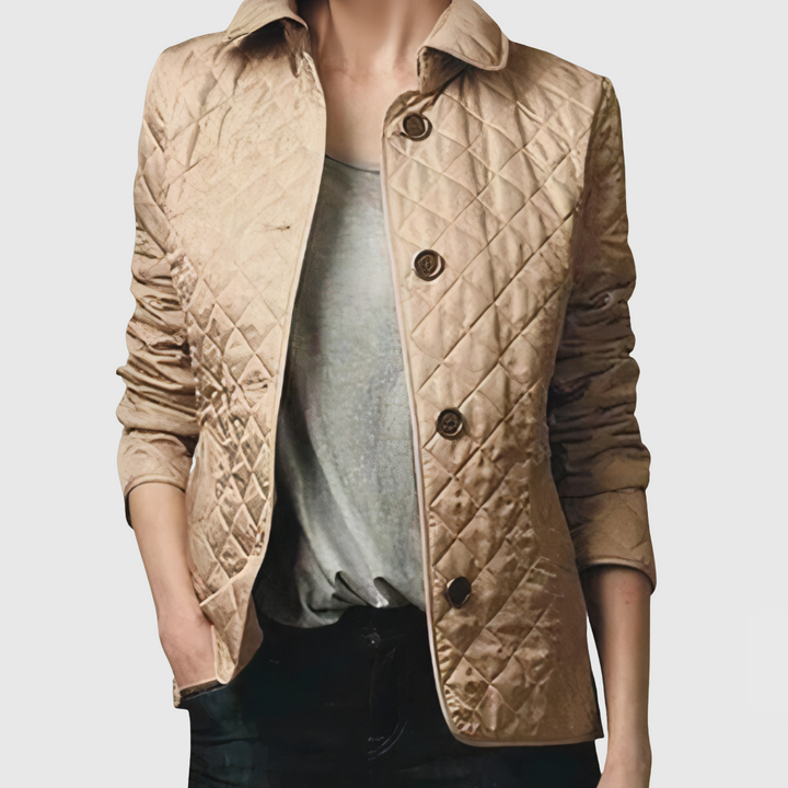A woman wearing an fall jacket over a top, layered for a crisp day in town.
