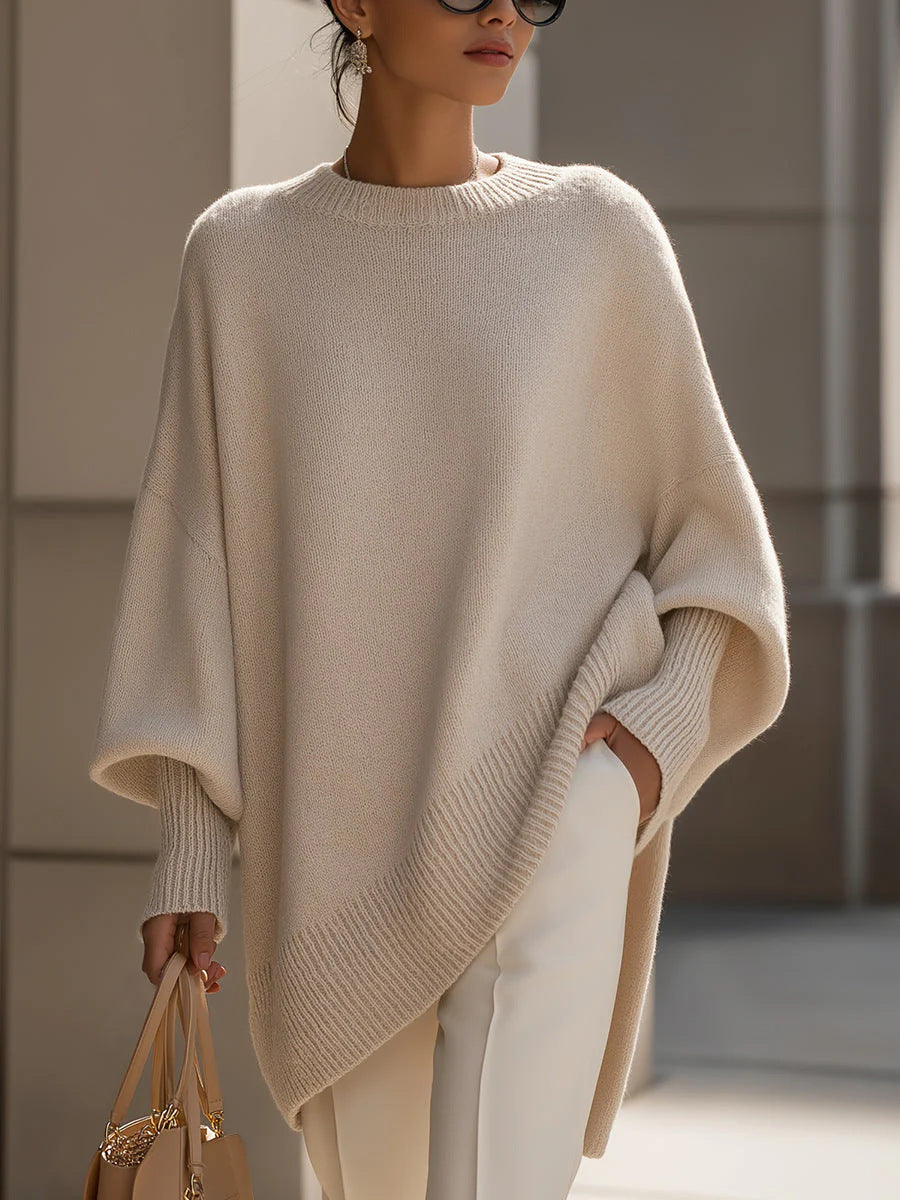A woman wearing a soft crew neck sweater with jeans for a warm, easy everyday look.