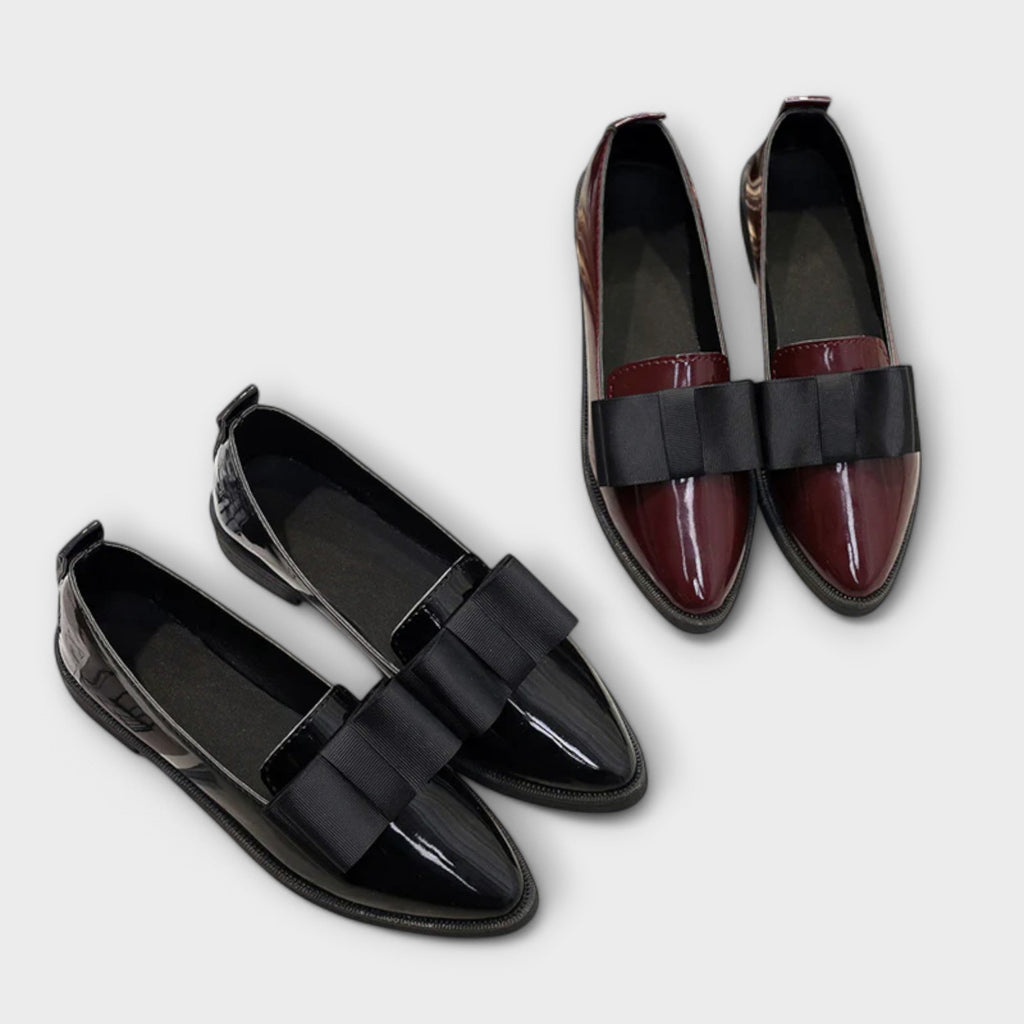 A woman wearing refined classic loafers with a smart everyday outfit