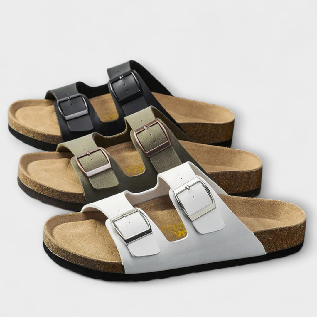 A woman strolling in the sunshine wearing supportive, cushioned everyday comfort sandals.