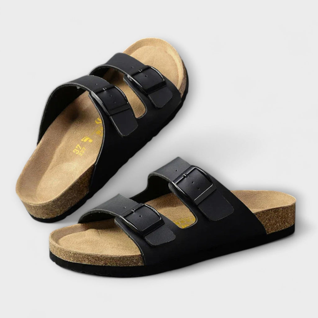 A woman strolling in the sunshine wearing supportive, cushioned everyday comfort sandals.