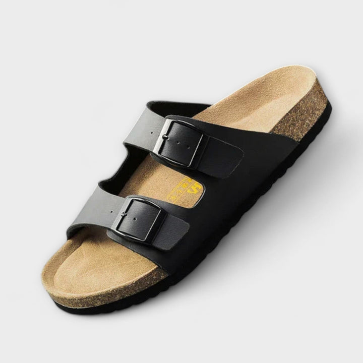 A woman strolling in the sunshine wearing supportive, cushioned everyday comfort sandals.