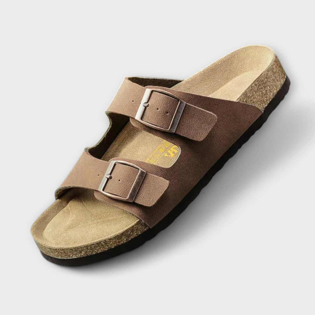 A woman strolling in the sunshine wearing supportive, cushioned everyday comfort sandals.