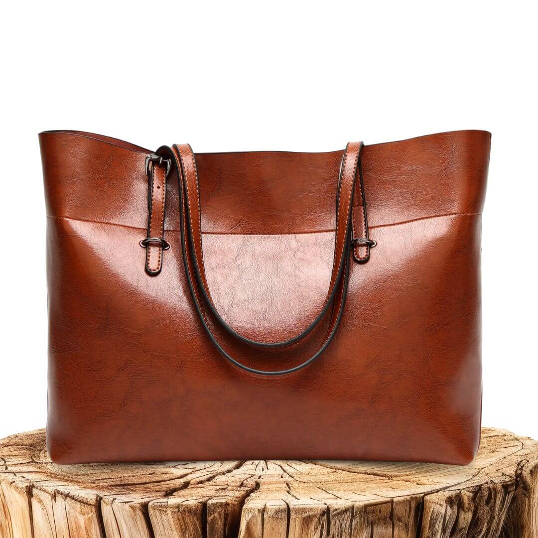 A woman carrying an elegant everyday handbag on her arm while out in town.