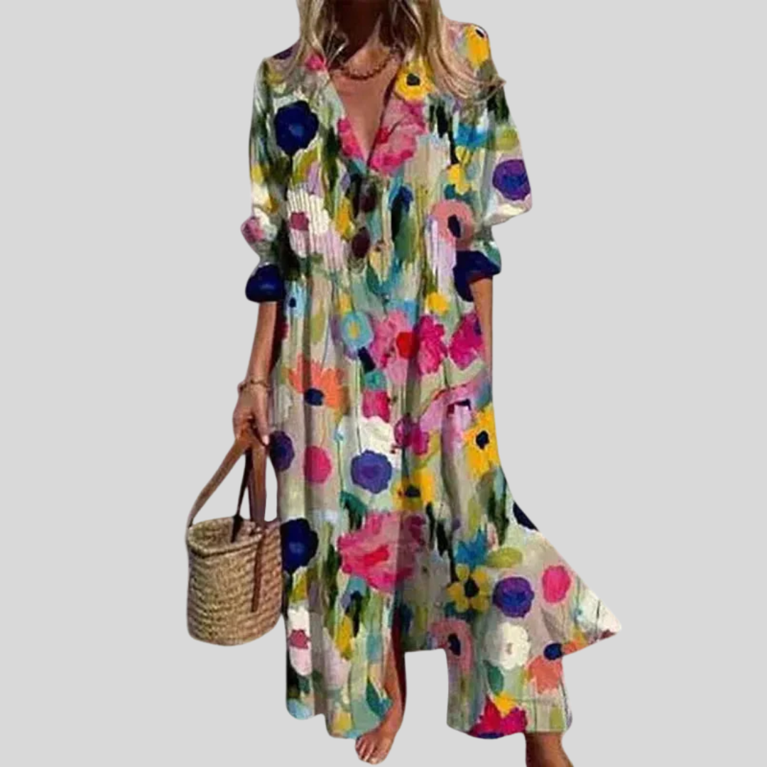 Woman in a long flowing boho-style maxi dress with delicate patterns, walking outdoors.